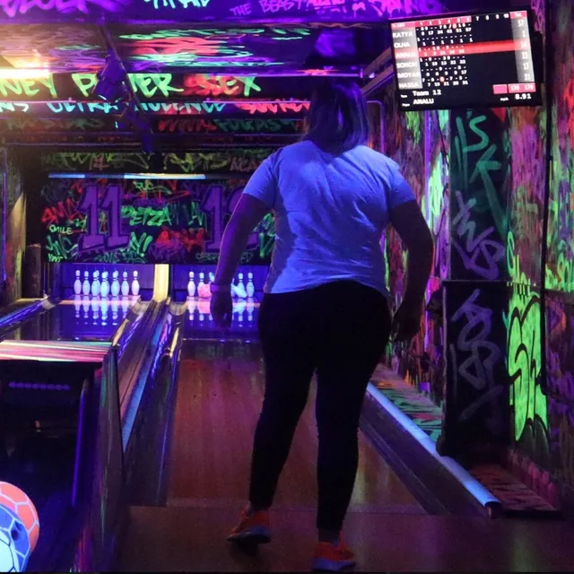 A student bowling during an EEC social activity