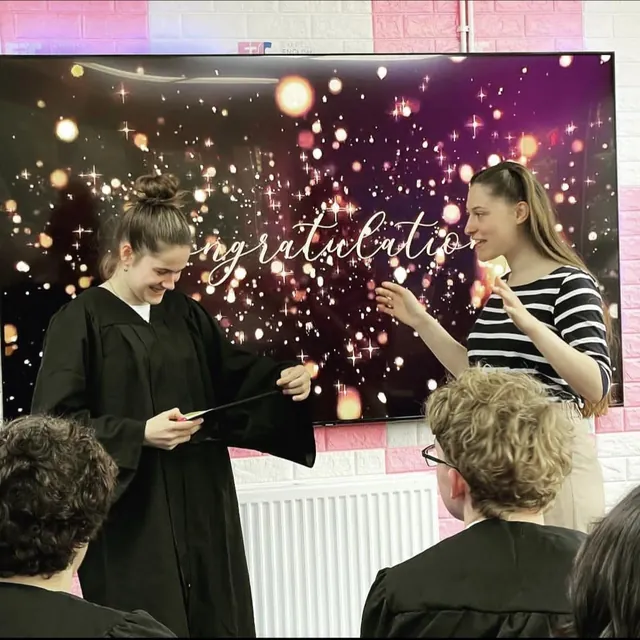 Students celebrating with sparklers at graduation